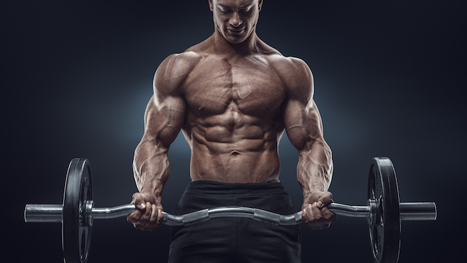 Closeup portrait of a muscular man workout with barbell at gym. Brutal bodybuilder athletic man with six pack, perfect abs, shoulders, biceps, triceps and chest. Deadlift barbells workout.